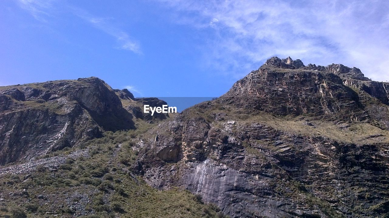 ROCKY MOUNTAINS AGAINST BLUE SKY