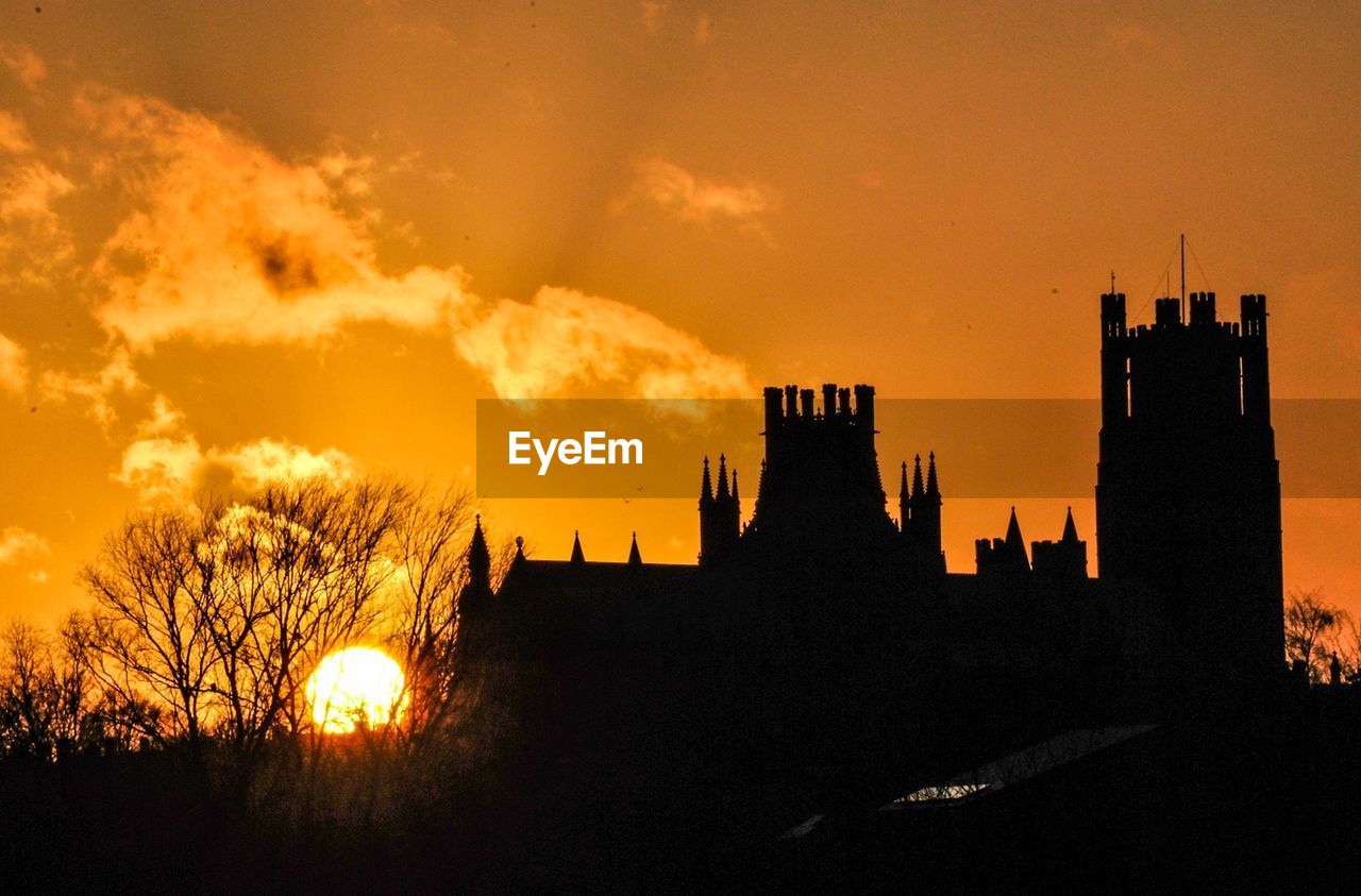 SILHOUETTE OF BUILDINGS AT SUNSET