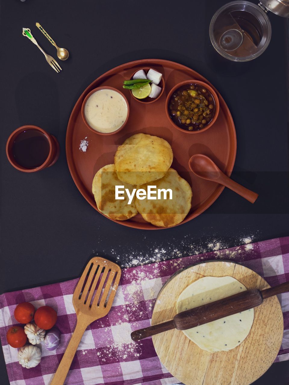 High angle view of indian breakfast, chole bhature on table.