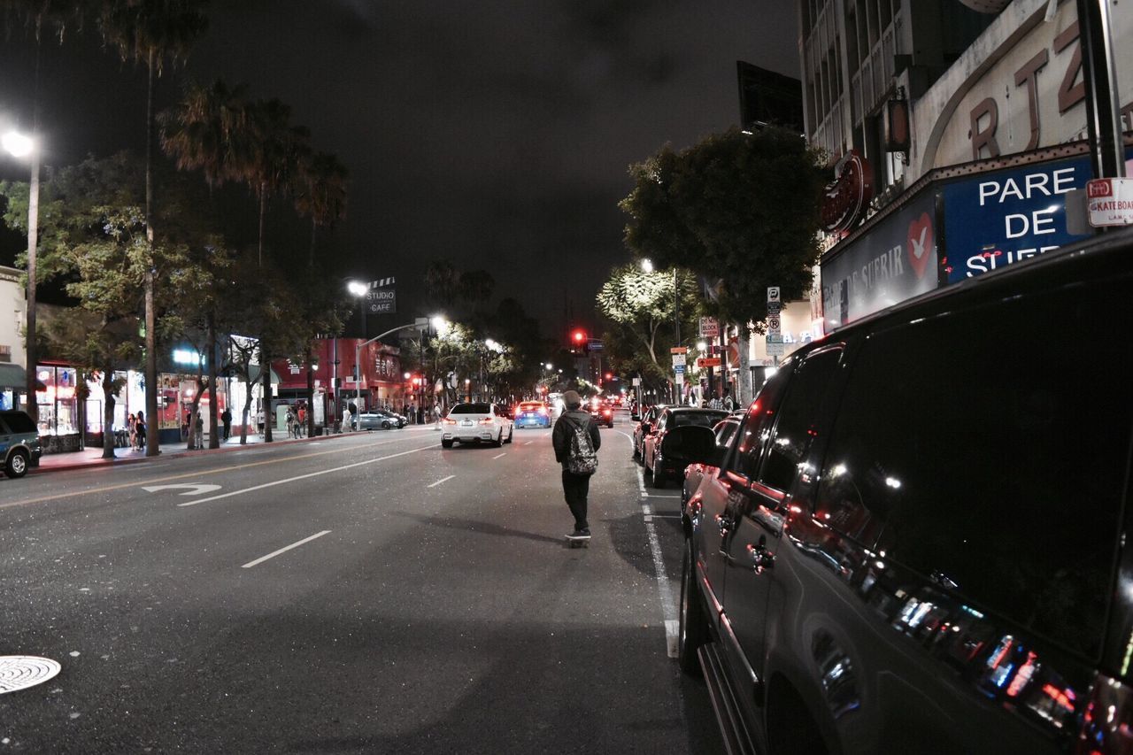 TRAFFIC ON STREET AT NIGHT