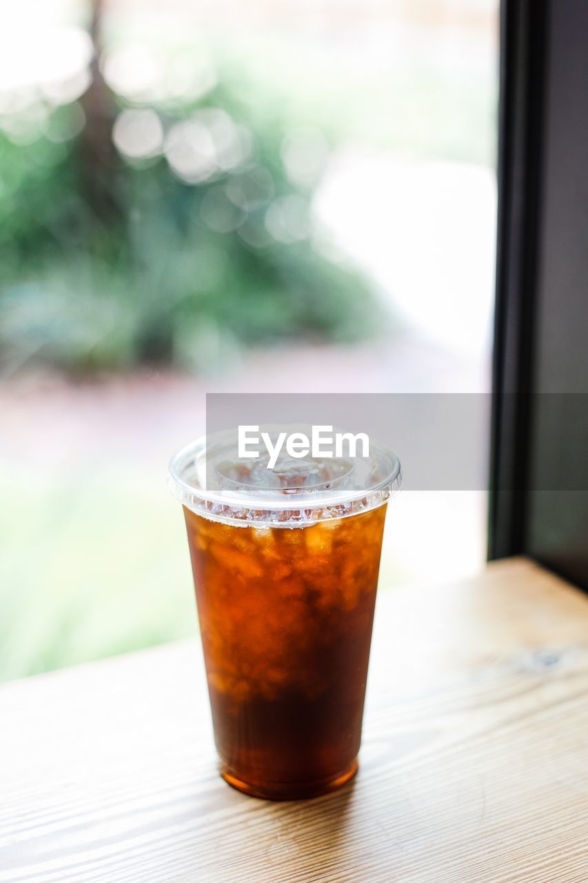 High angle view of drink in disposable cup on table