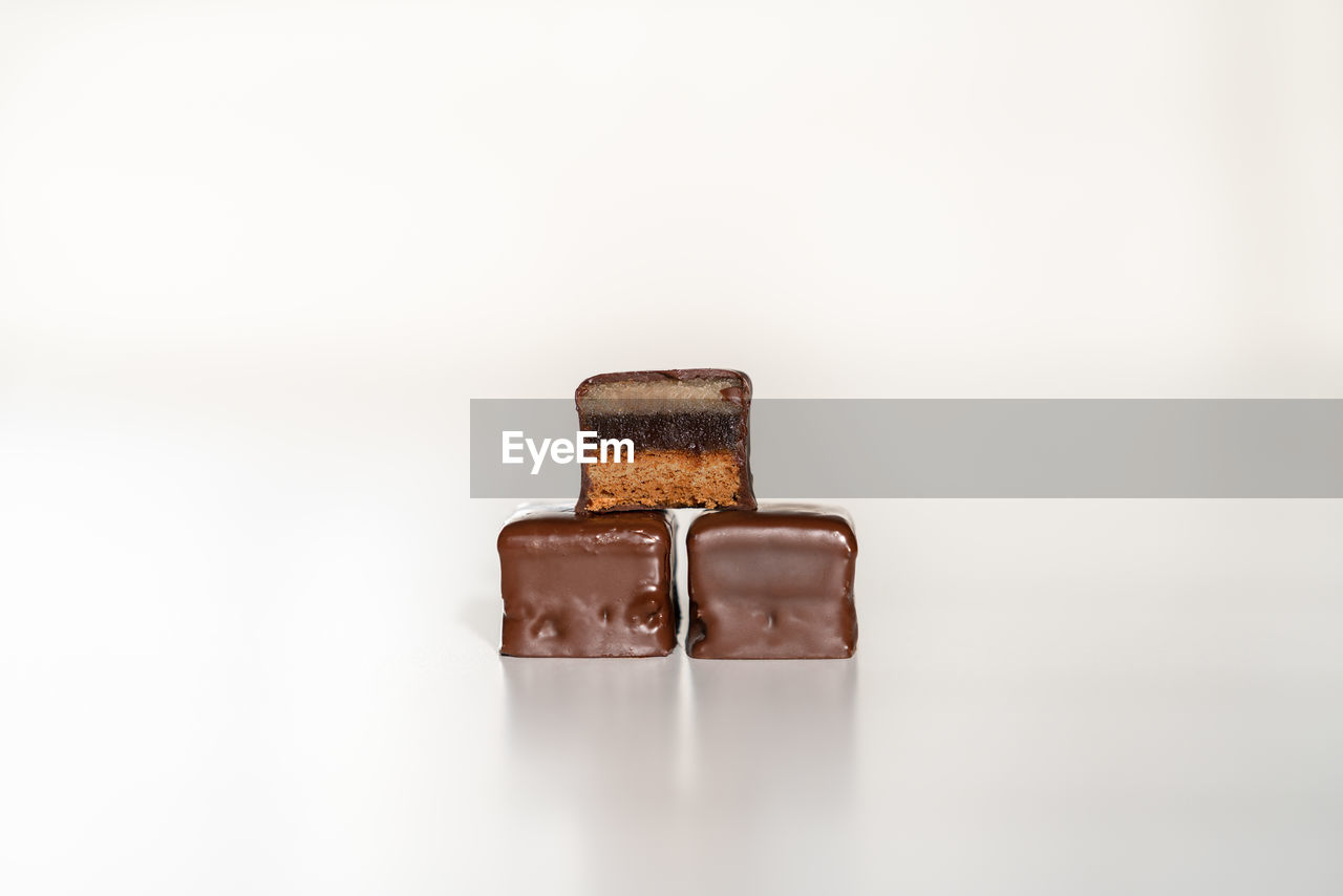 Close-up of chocolate cookies against white background