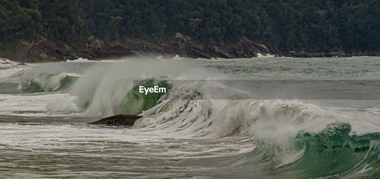 Sea waves splashing on shore