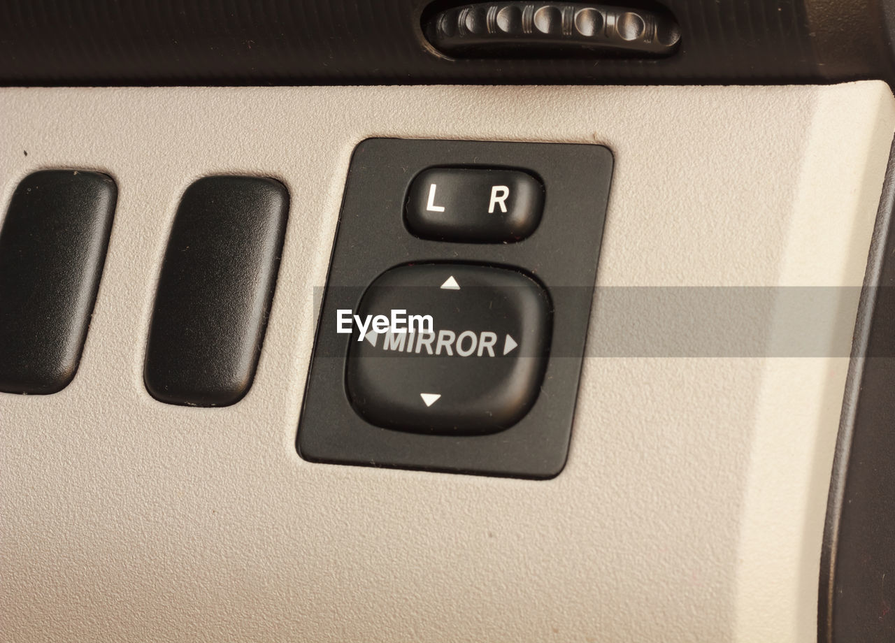Close-up of buttons in car