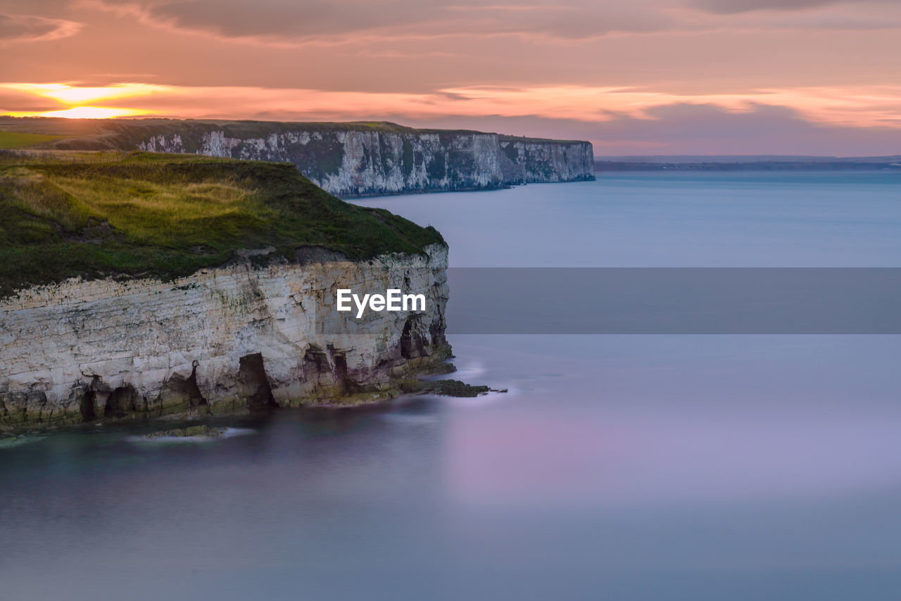 Scenic view of sea against sky at sunset