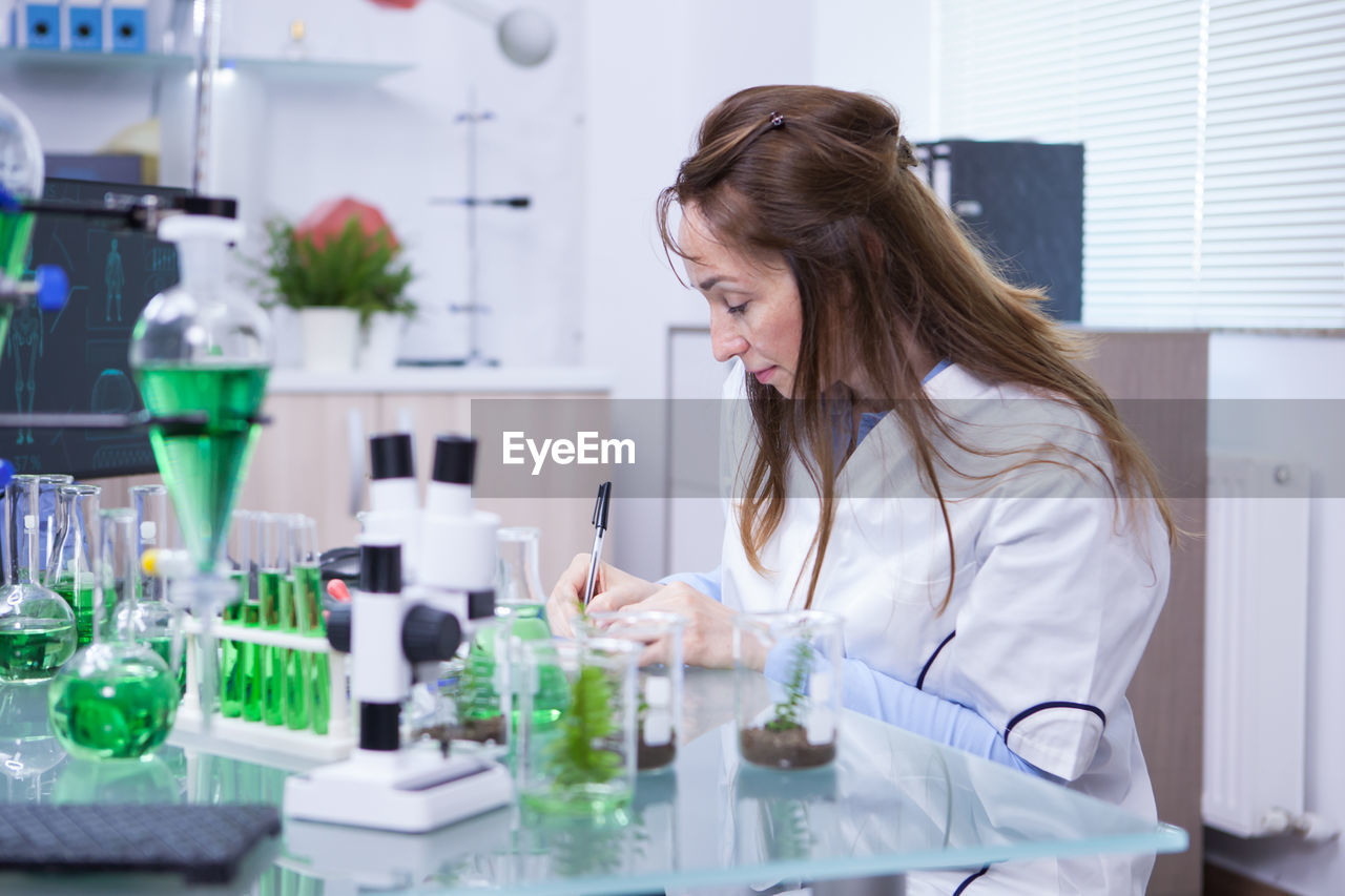 female doctor examining chemical