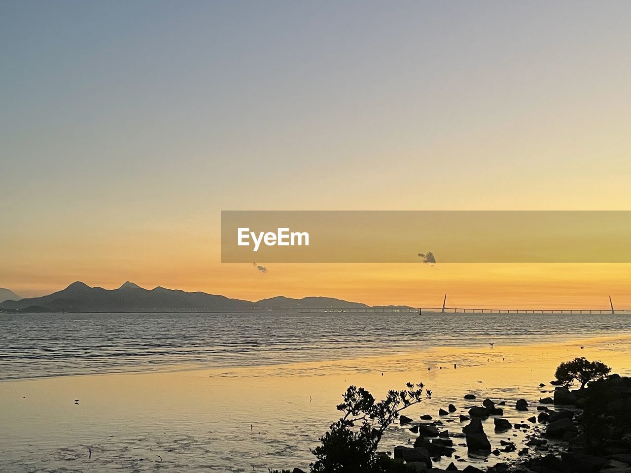 SCENIC VIEW OF SEA DURING SUNSET