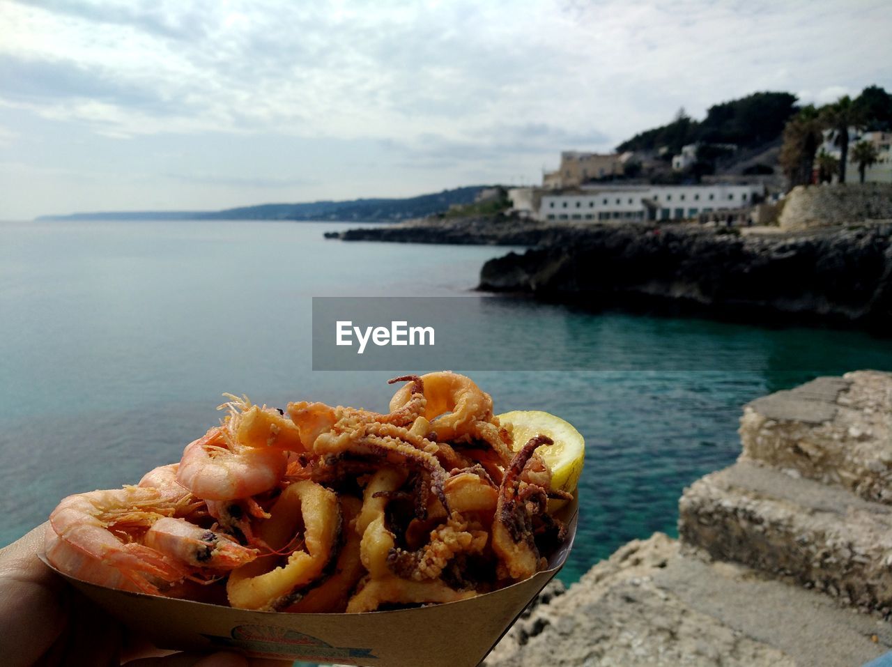 CLOSE-UP OF BREAD ON SHORE