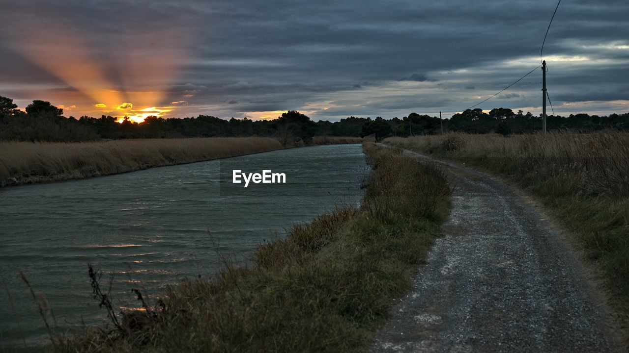 SCENIC VIEW OF LAND DURING SUNSET