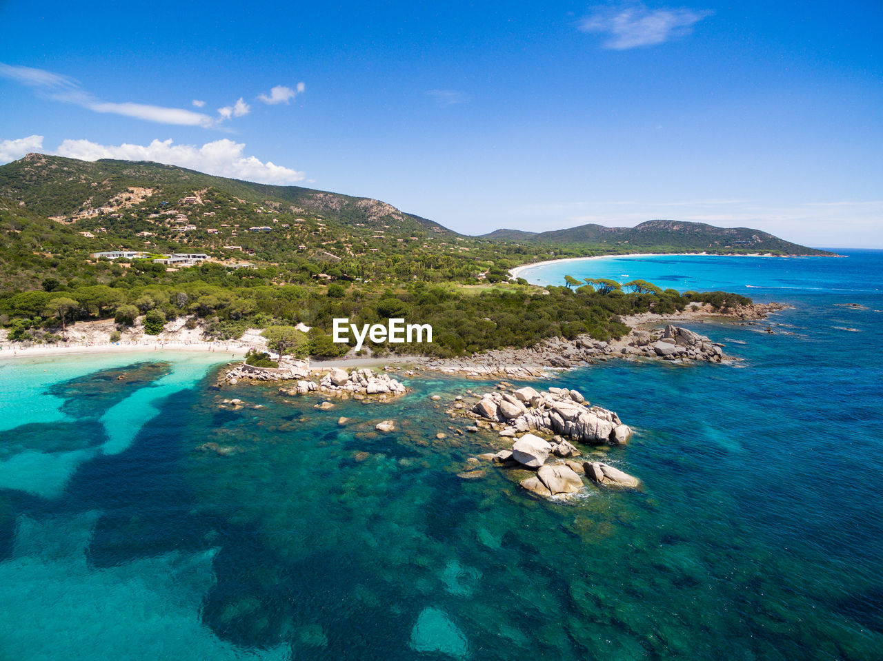 Scenic view of sea and mountains against sky