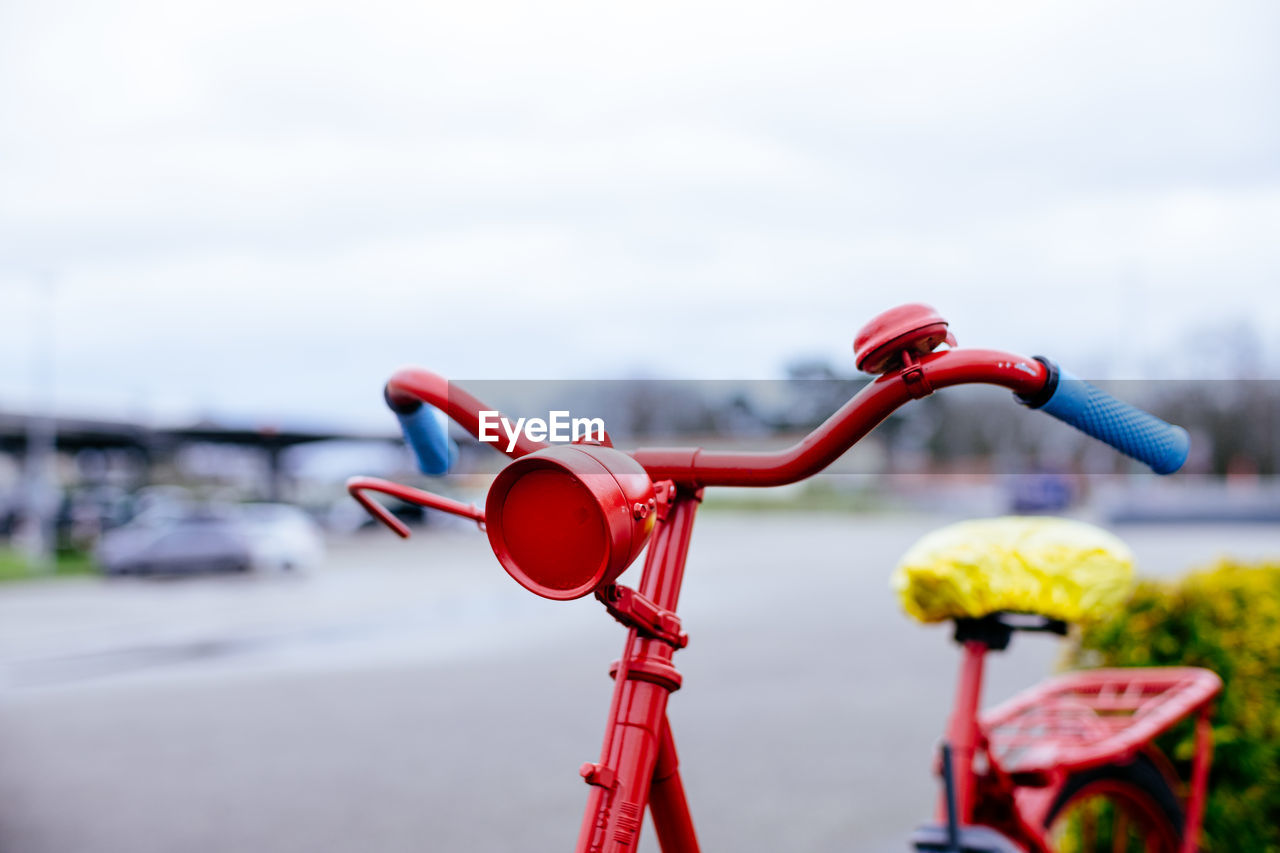 Front section of red painted bicycle