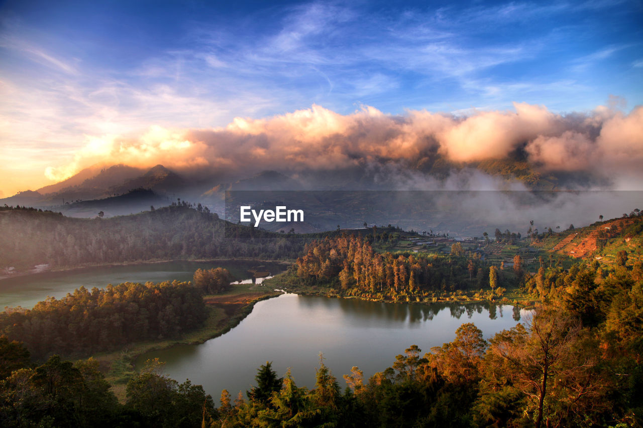 Scenic view of lake against sky during sunset