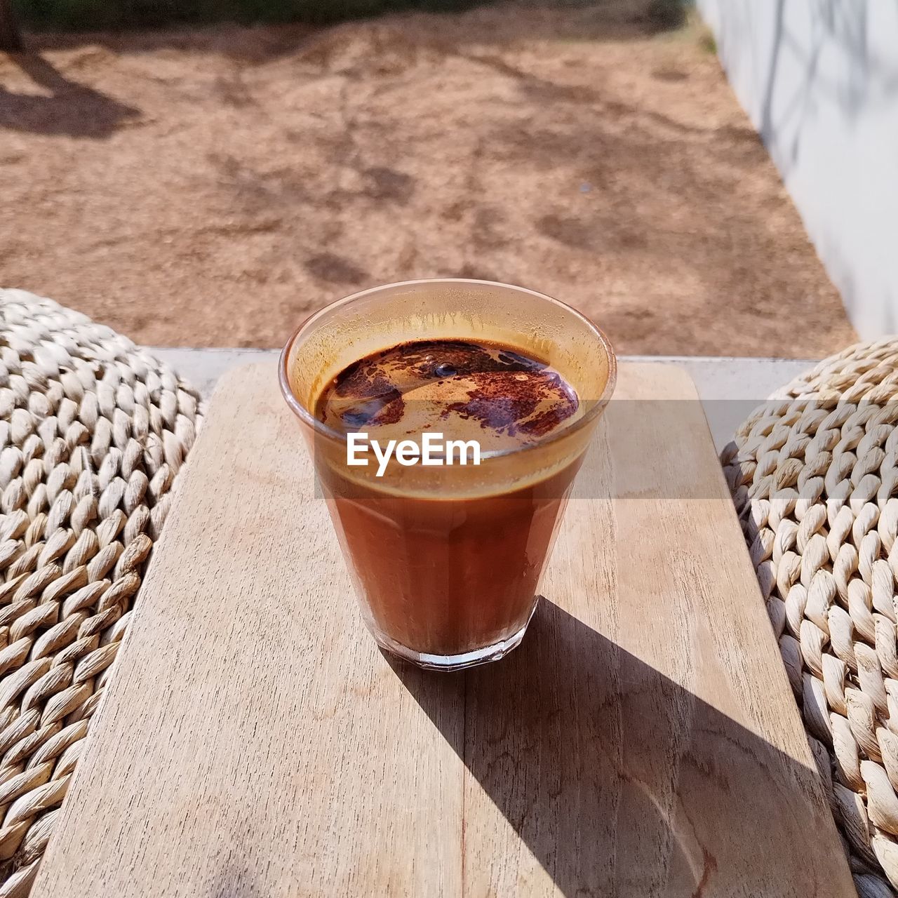 food and drink, drink, refreshment, food, coffee, sunlight, glass, table, drinking glass, no people, freshness, soft drink, wood, household equipment, day, high angle view, produce, nature, outdoors, still life, cold drink, summer, container