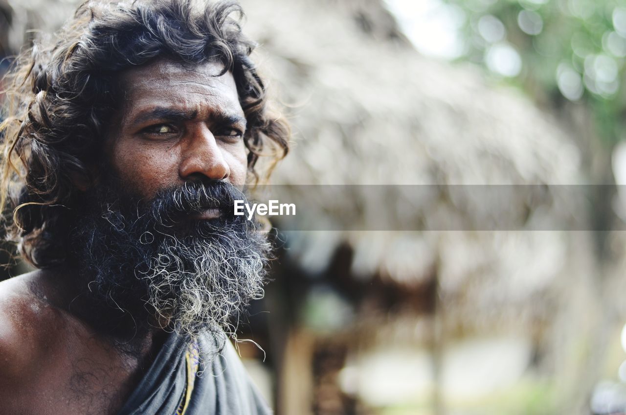 Close-up portrait of bearded man