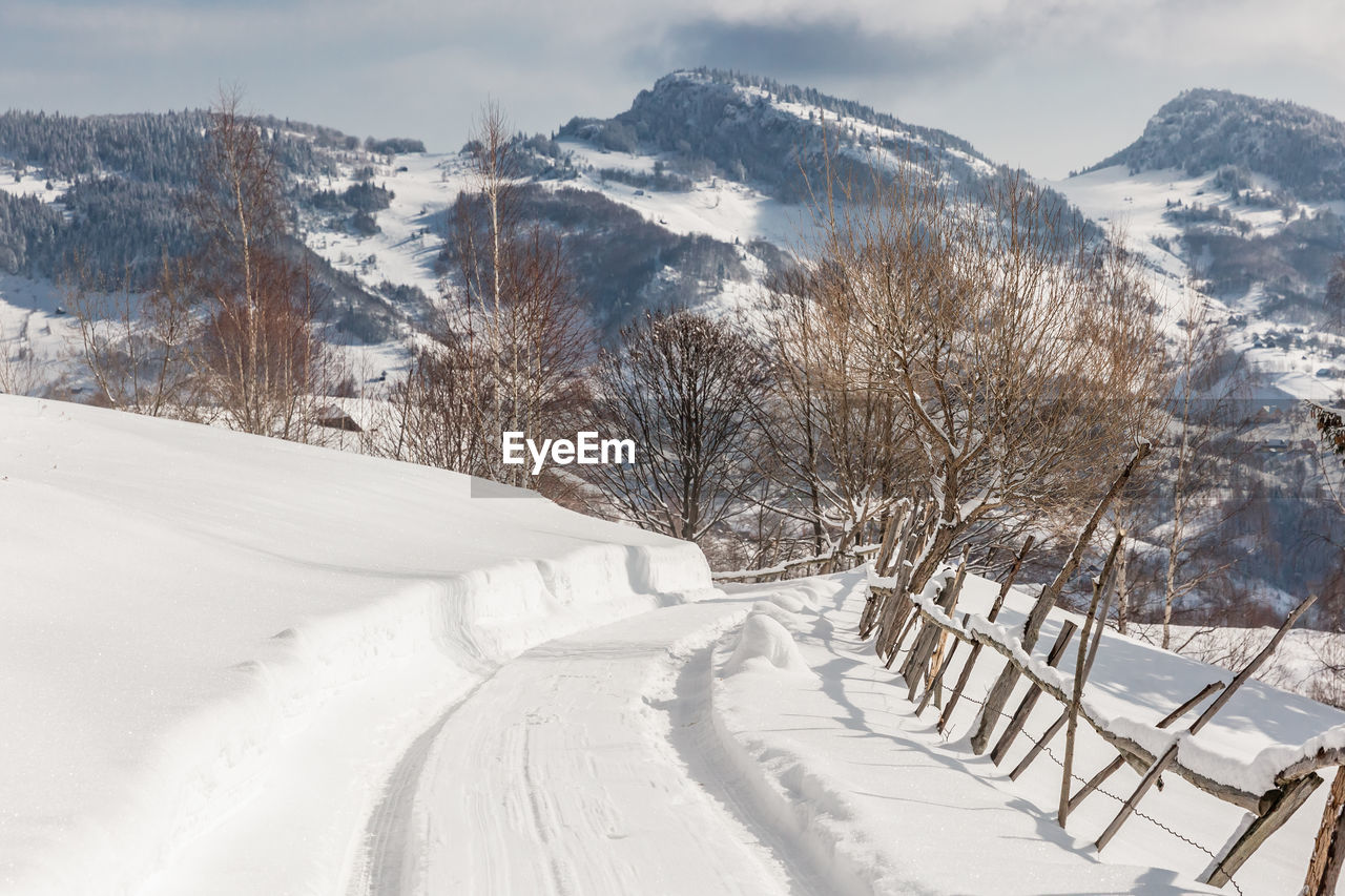Snow covered mountain against sky