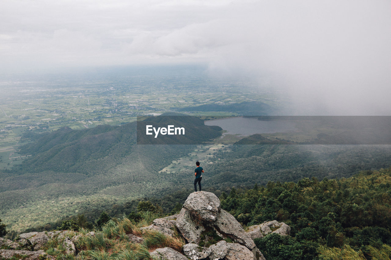 Man looking at mountains