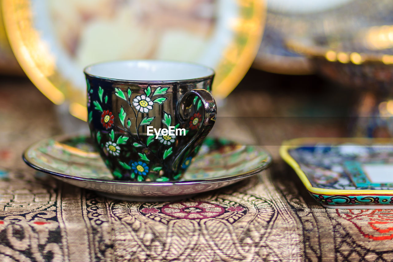 Close-up of antique cup for sale at market