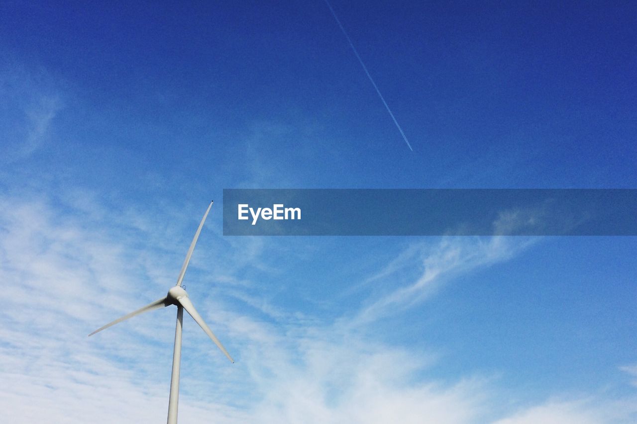 Wind turbine against sky