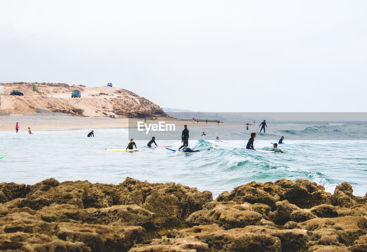 GROUP OF PEOPLE ON BEACH