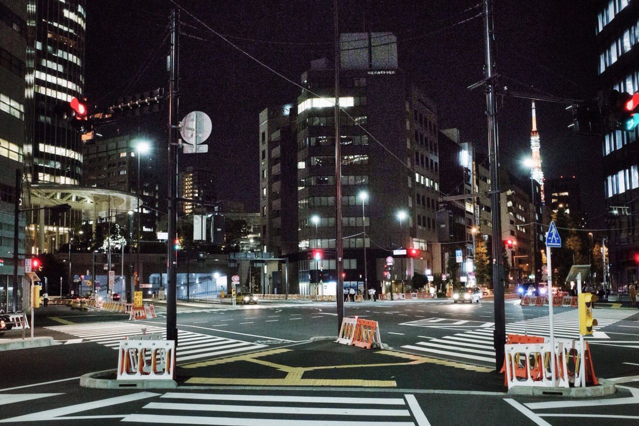 VIEW OF CITY STREET AT NIGHT