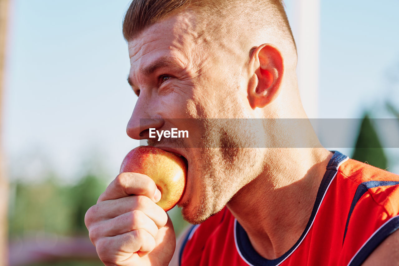close-up of senior man eating food