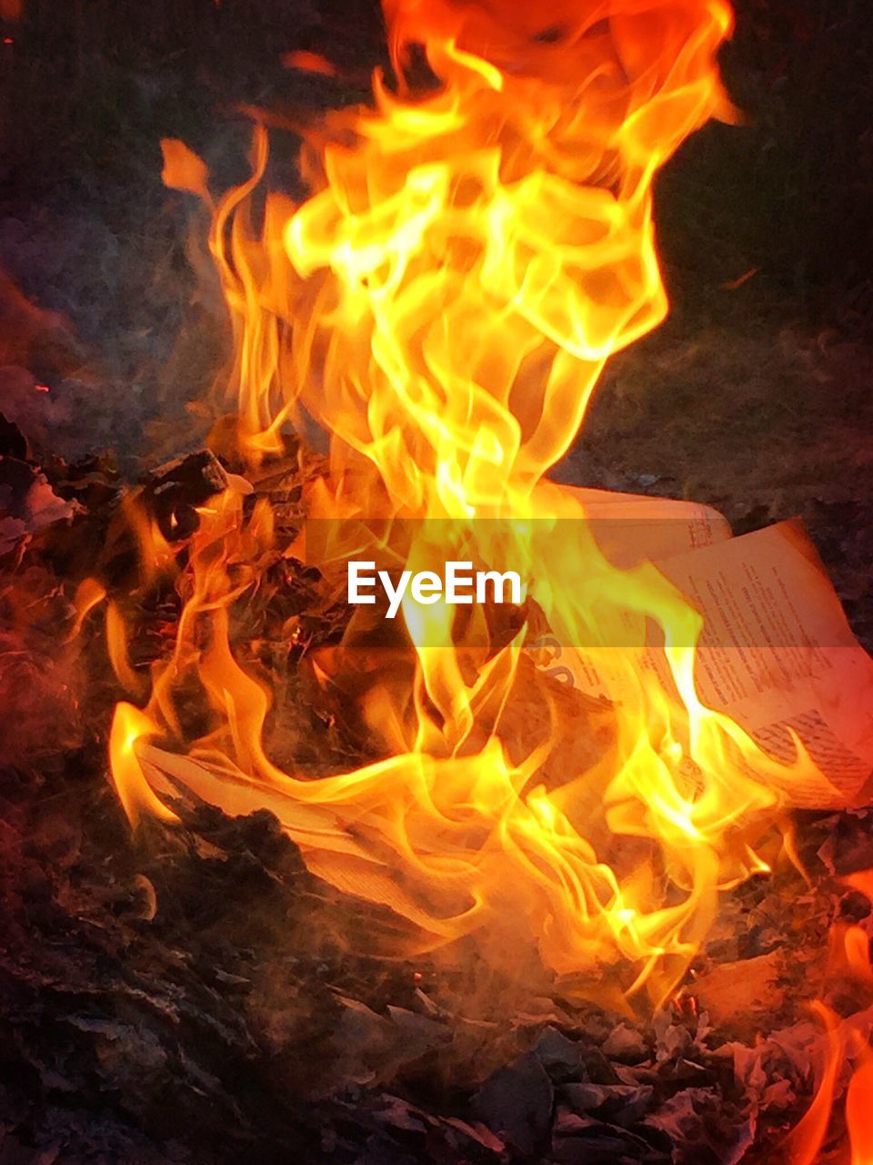 High angle view of burning papers