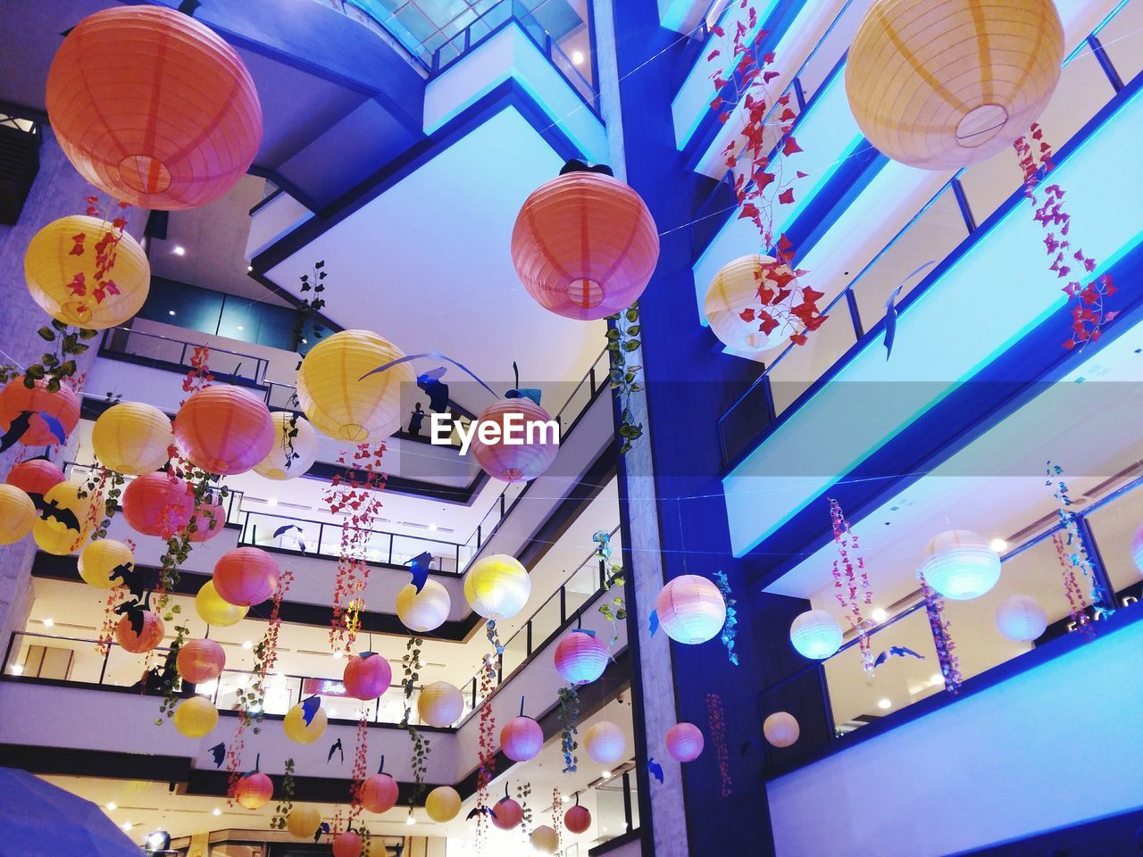 LOW ANGLE VIEW OF LANTERN HANGING ON CEILING