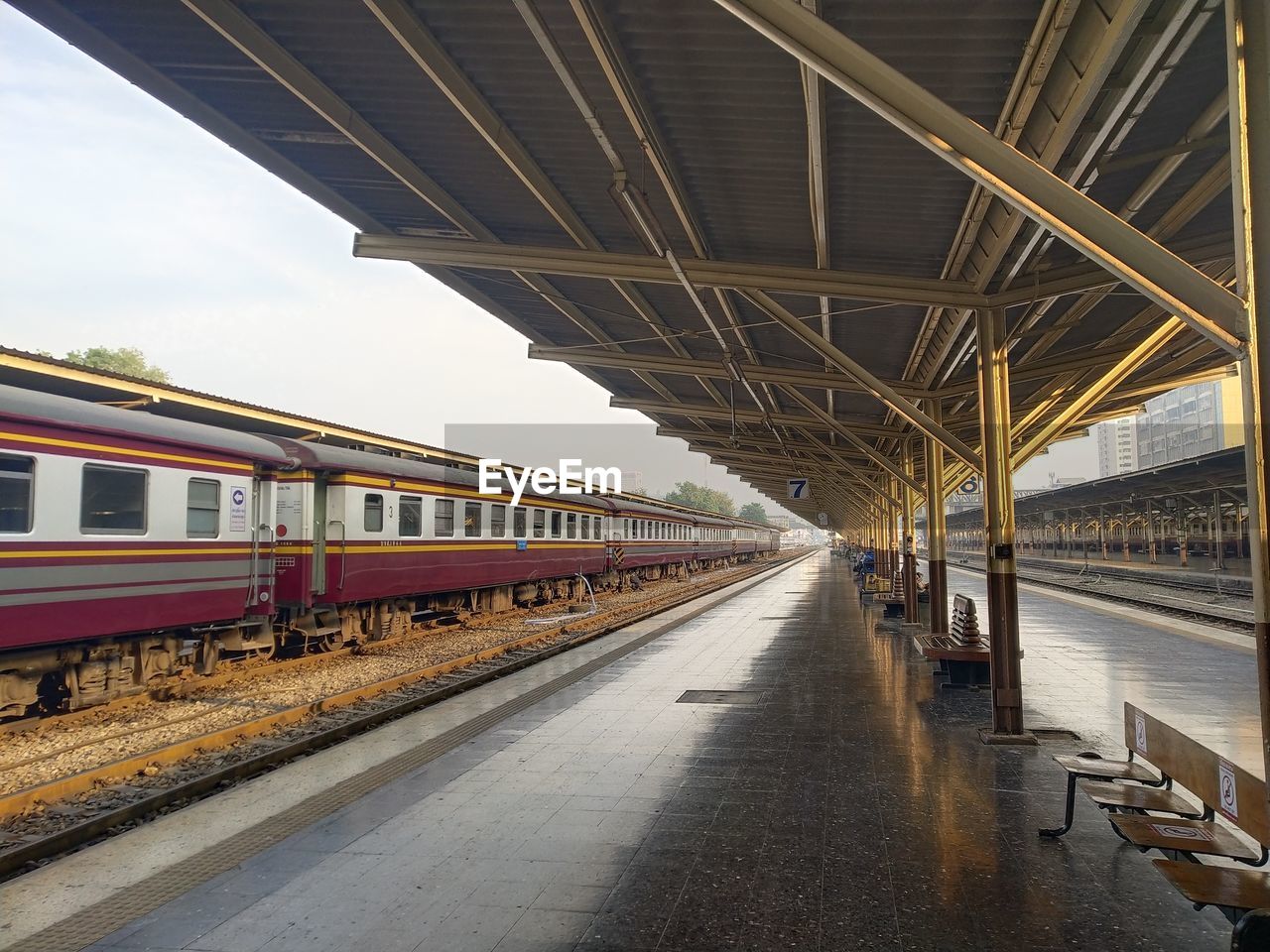 Train at railroad station against sky