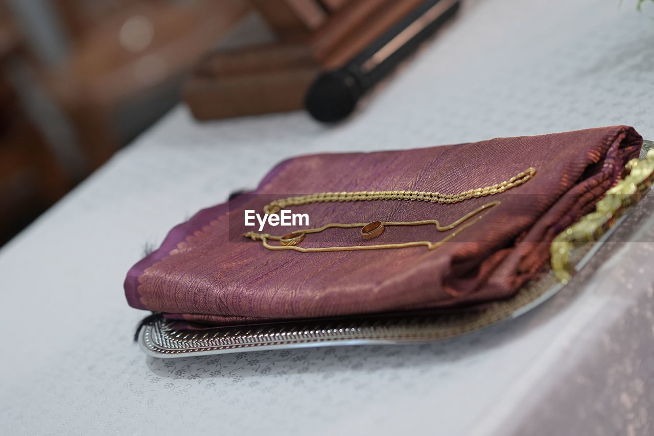 brown, leather, no people, close-up, indoors, chocolate, coin purse, selective focus, pink