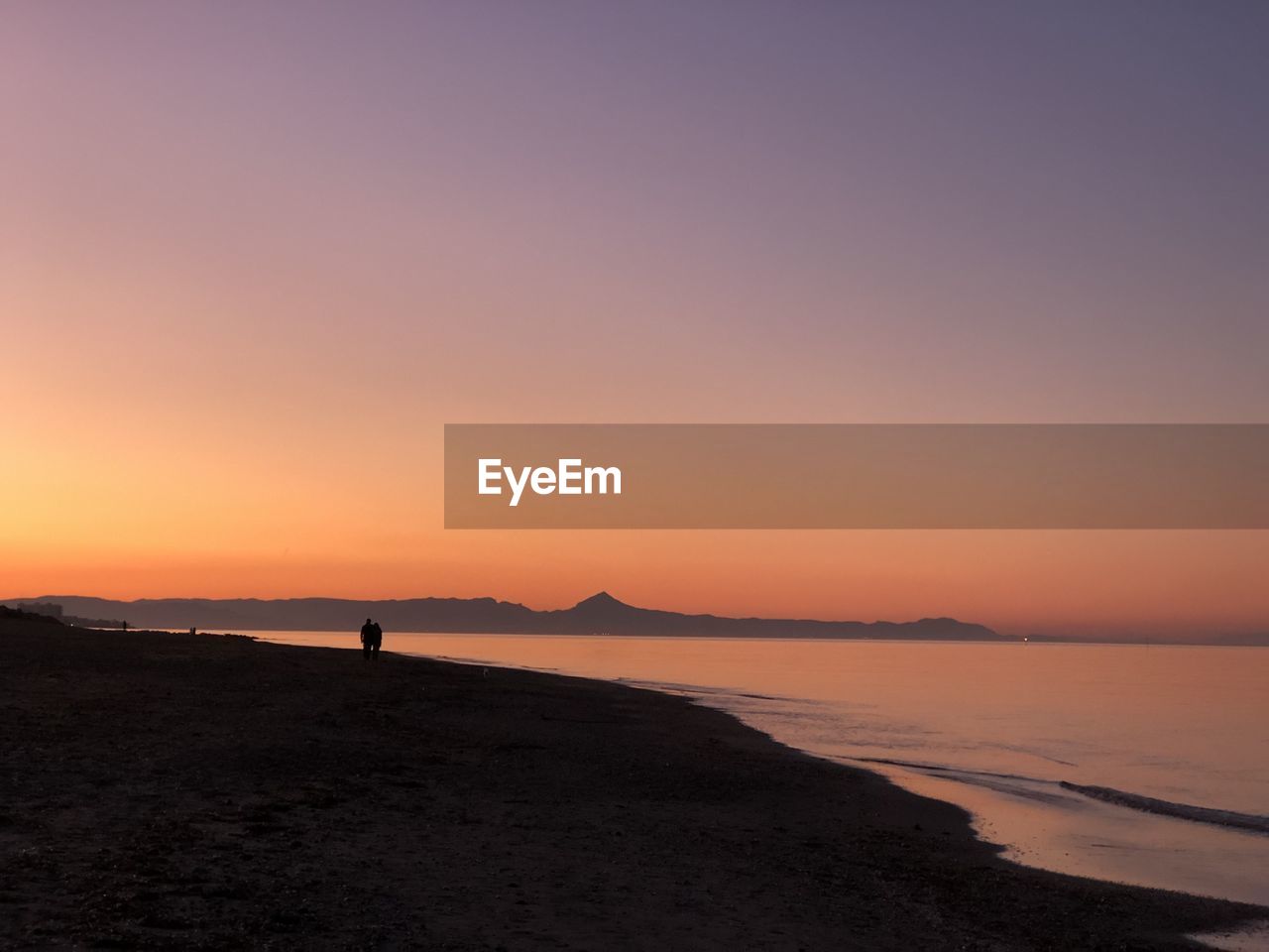 Scenic view of sea against clear sky during sunset