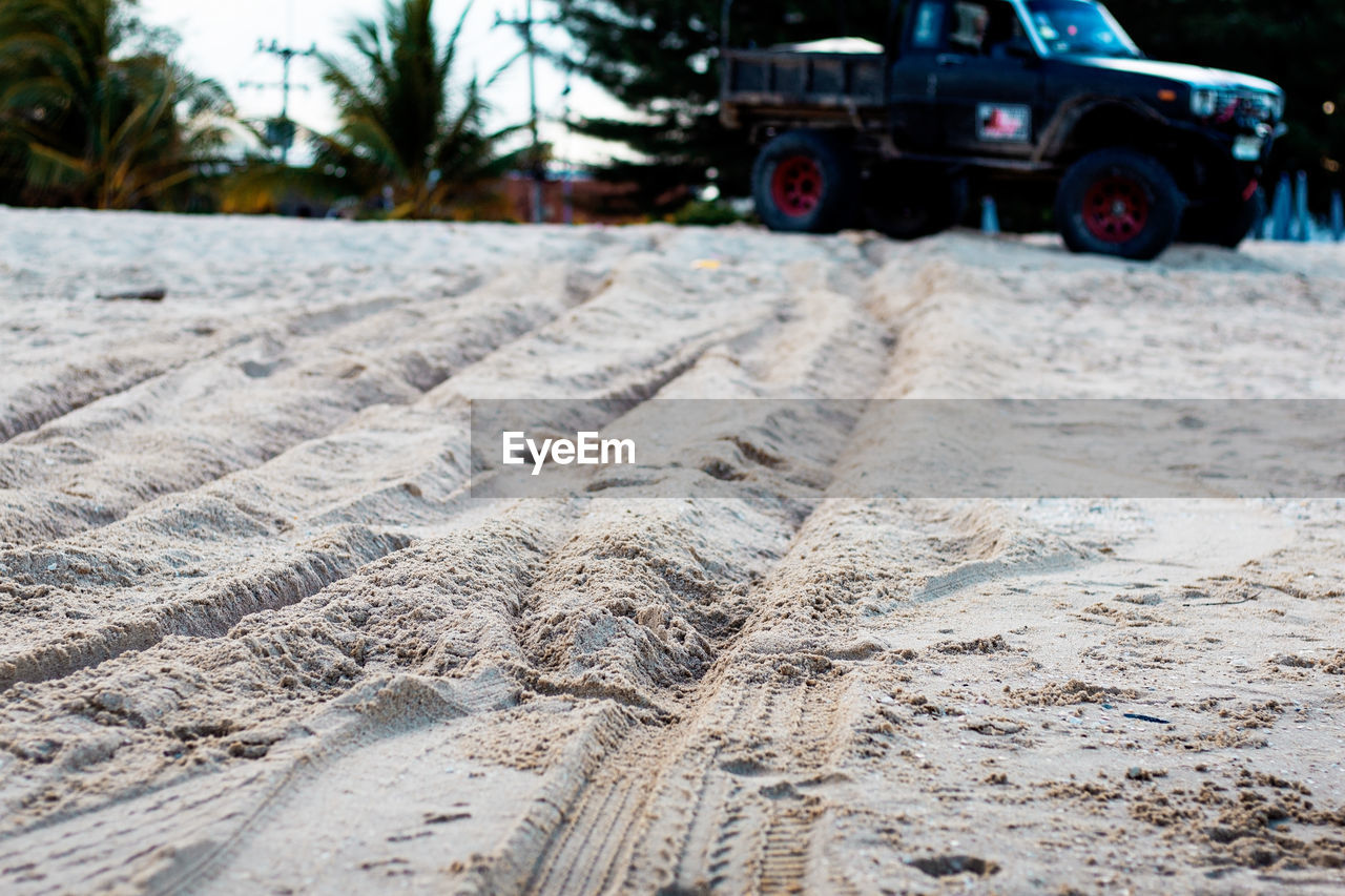 SURFACE LEVEL OF TIRE TRACKS ON LAND