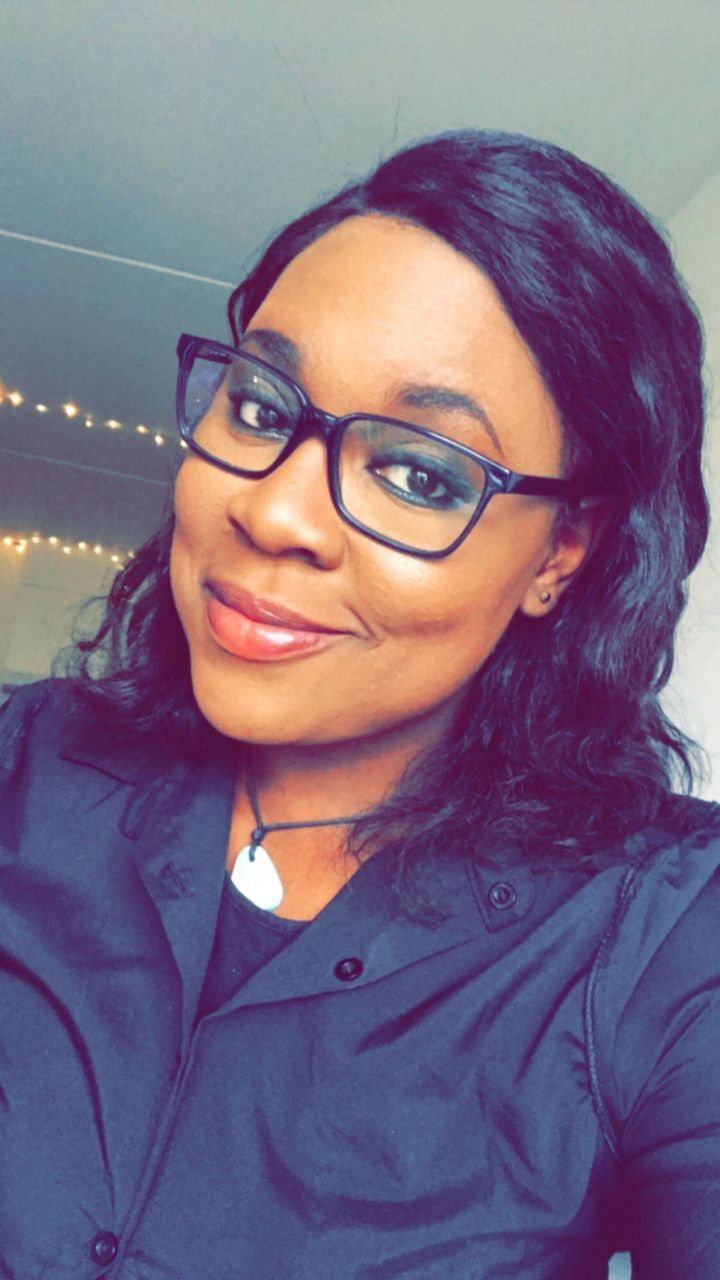 Close-up portrait of woman wearing eyeglasses