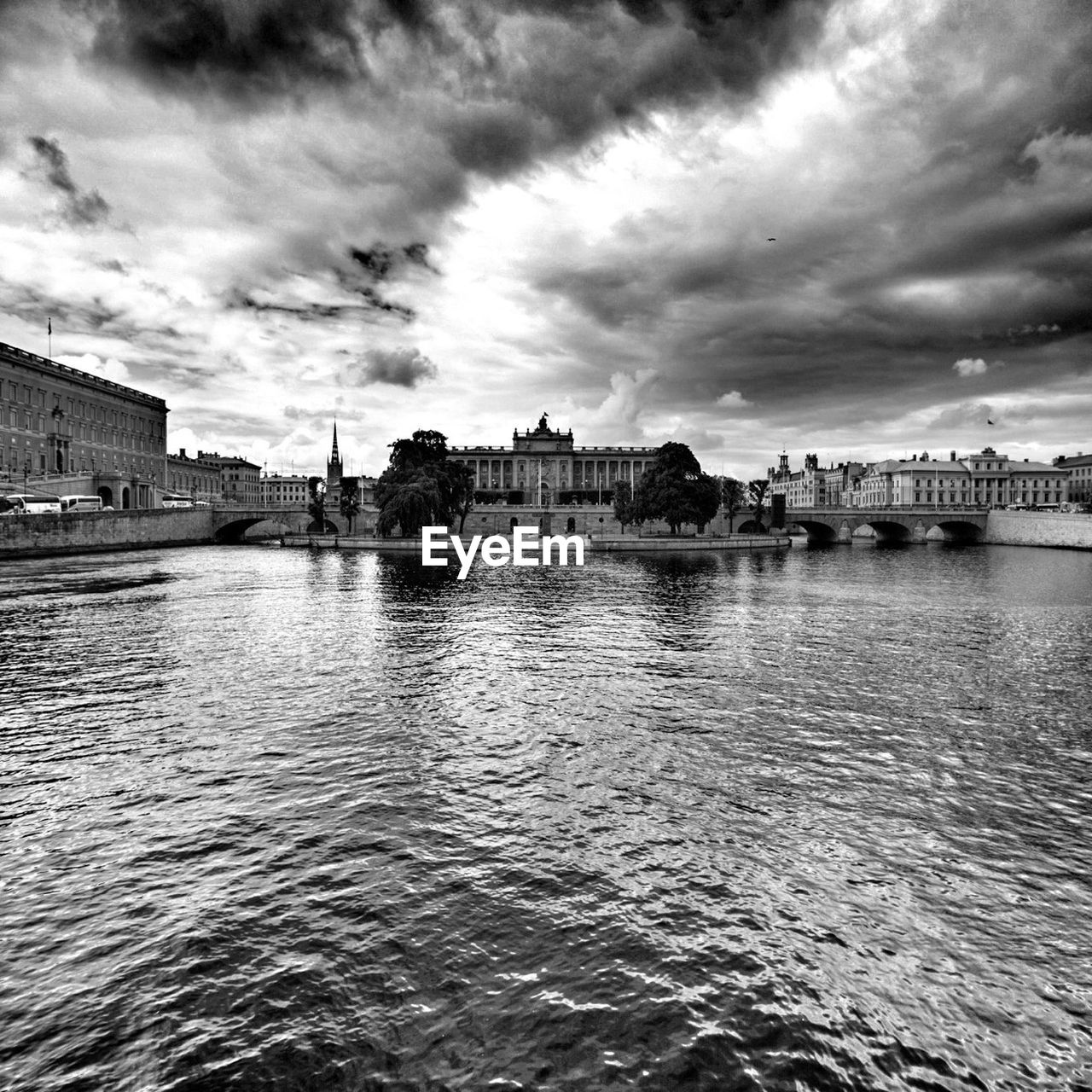 RIVER WITH BUILDINGS IN BACKGROUND