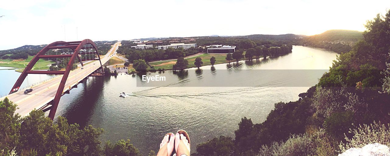 High angle view of river and bridge against sky