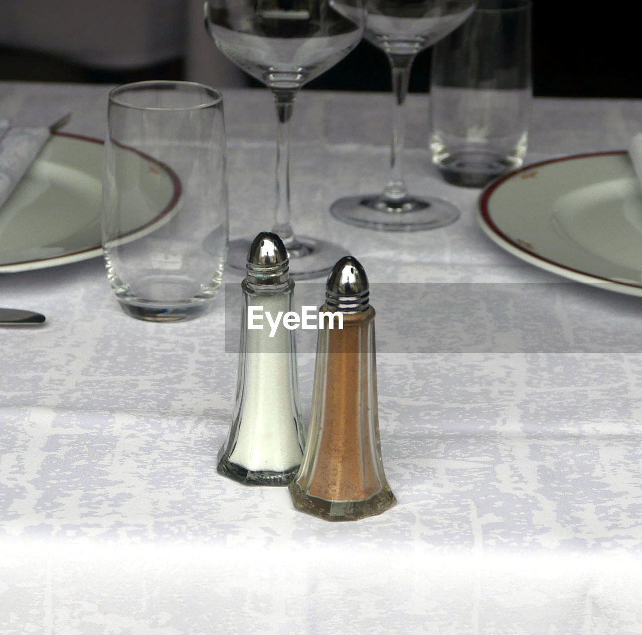 Close-up of salt and pepper shaker on table