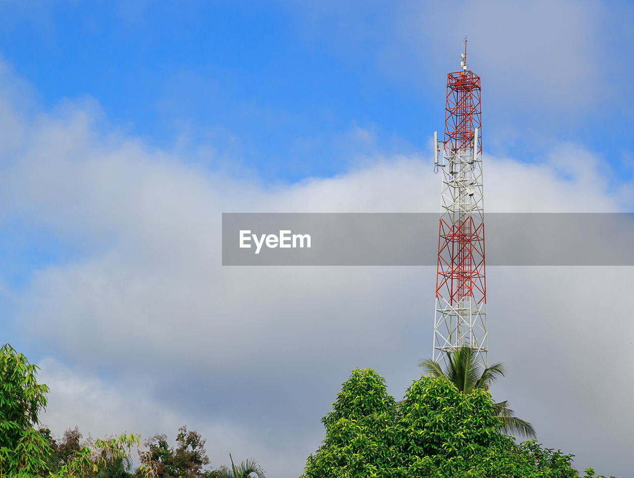 Antenna and cellular tower in blue sky background