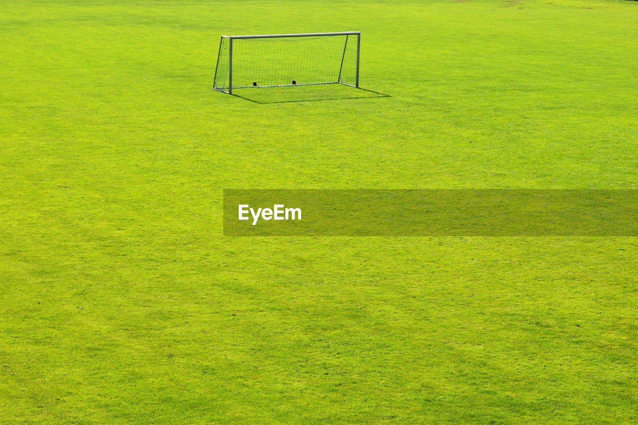 HIGH ANGLE VIEW OF SOCCER FIELD AGAINST GREEN BACKGROUND