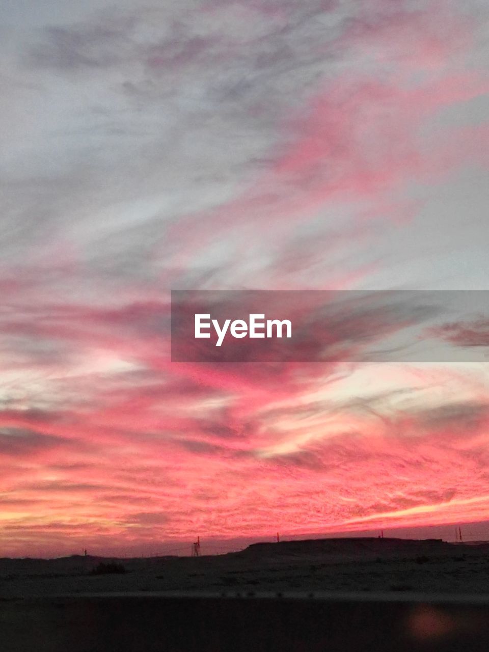 SCENIC VIEW OF DRAMATIC SKY OVER LANDSCAPE