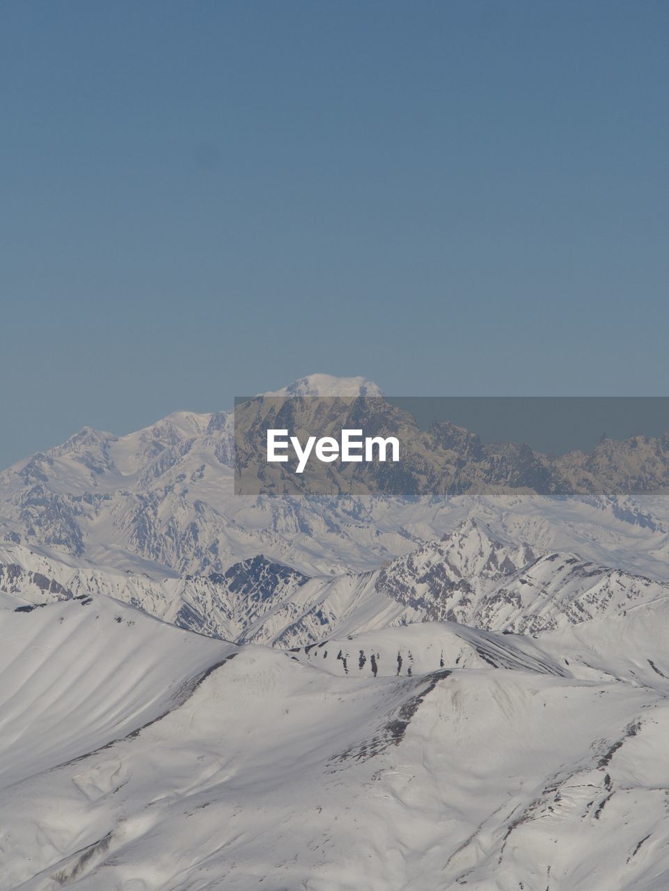Scenic view of snowcapped mountain against sky.