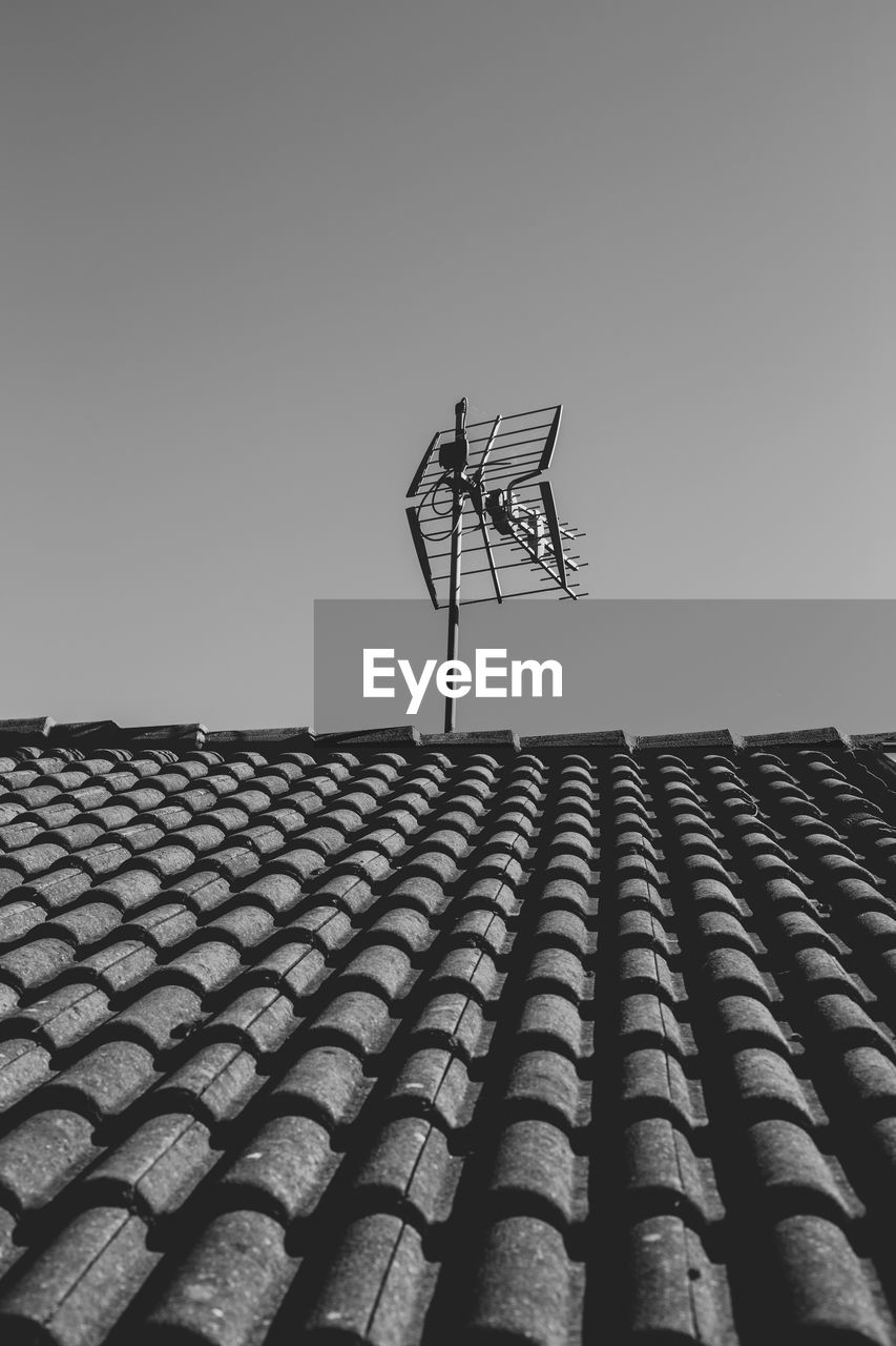 Antenna on a roof in black and white