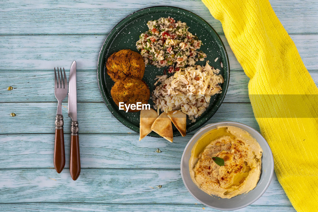 Typical dish of mediterranean cuisine in a wooden background