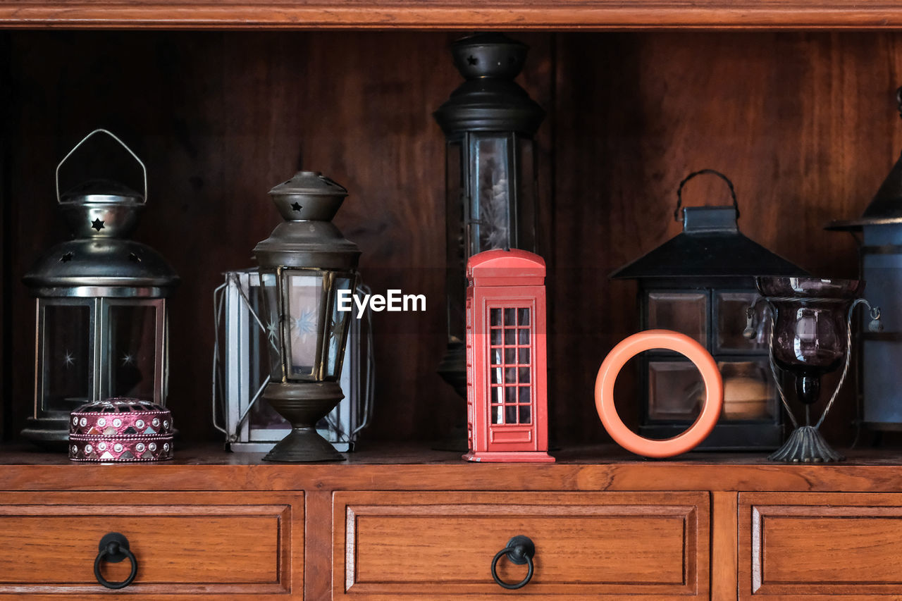 Various lanterns on wooden table