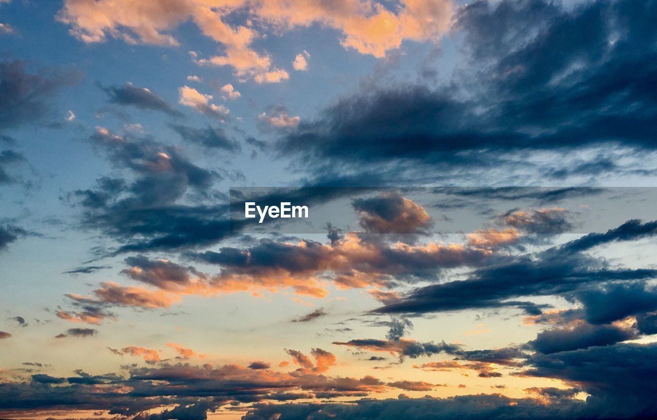 Low angle view of dramatic sky during sunset