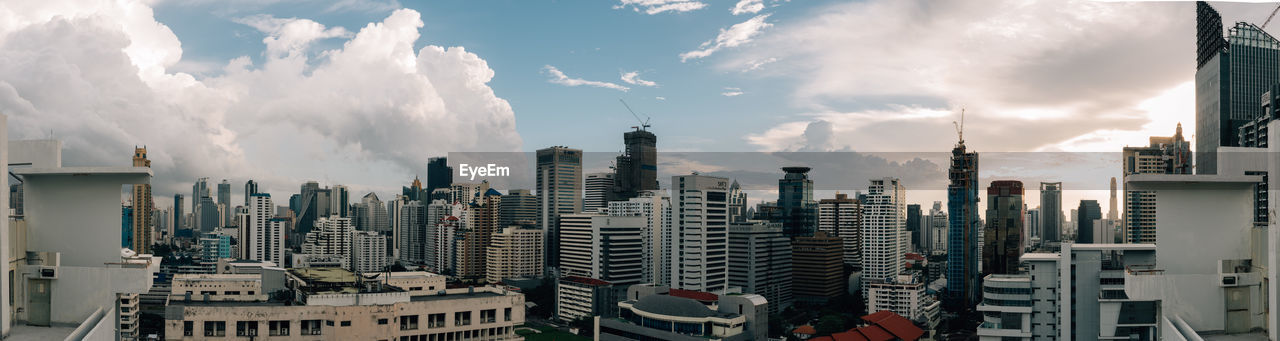 Panoramic view of city buildings against sky