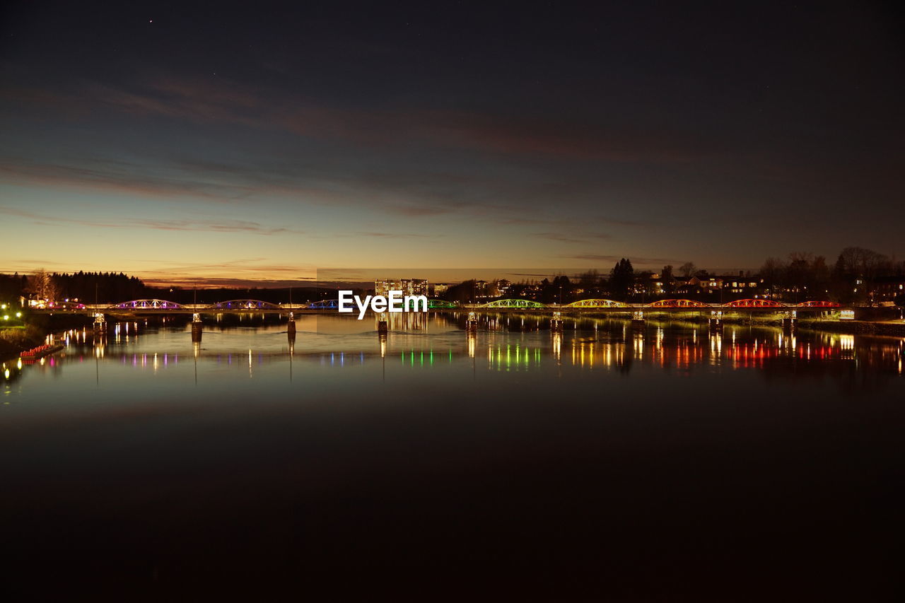 water, reflection, sky, architecture, night, dusk, built structure, building exterior, city, illuminated, evening, nature, horizon, no people, waterfront, building, sunset, light, travel destinations, beauty in nature, cityscape, sea, cloud, outdoors, scenics - nature, tranquility, copy space, darkness