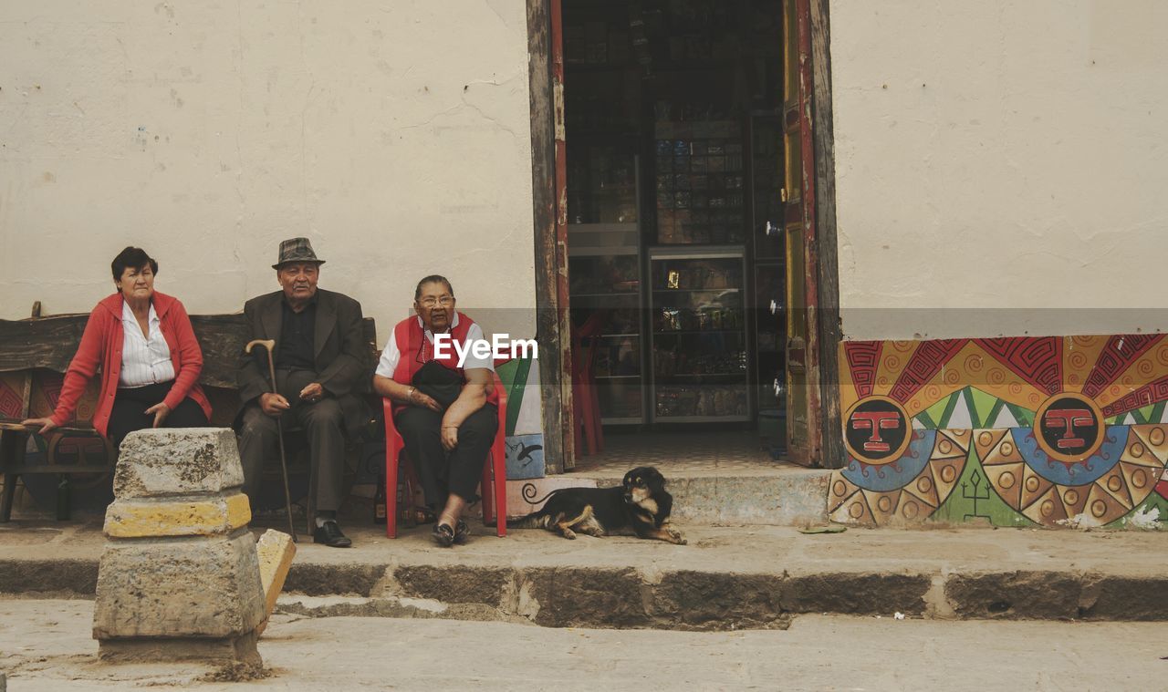 PEOPLE WORKING AT MARKET STALL