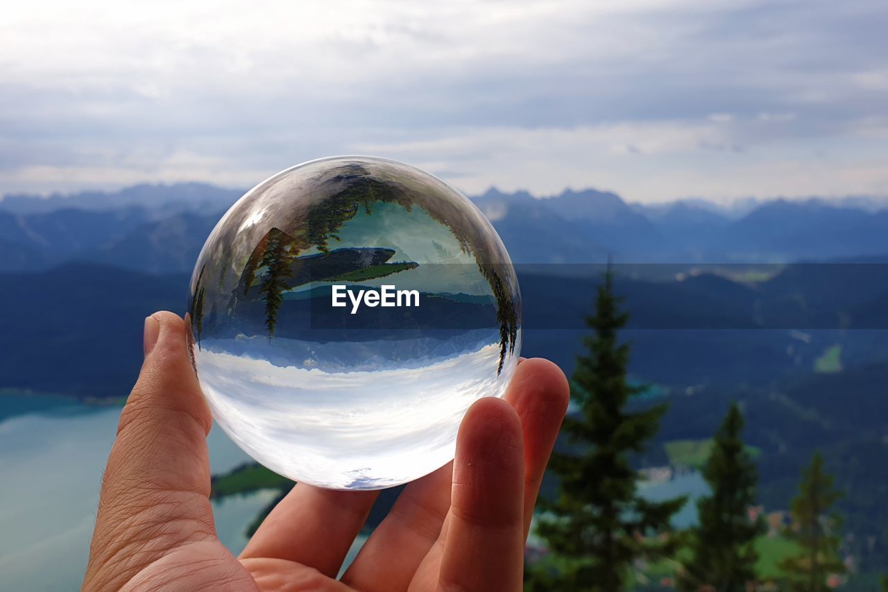 Lake walchensee reflecting in a crystal ball