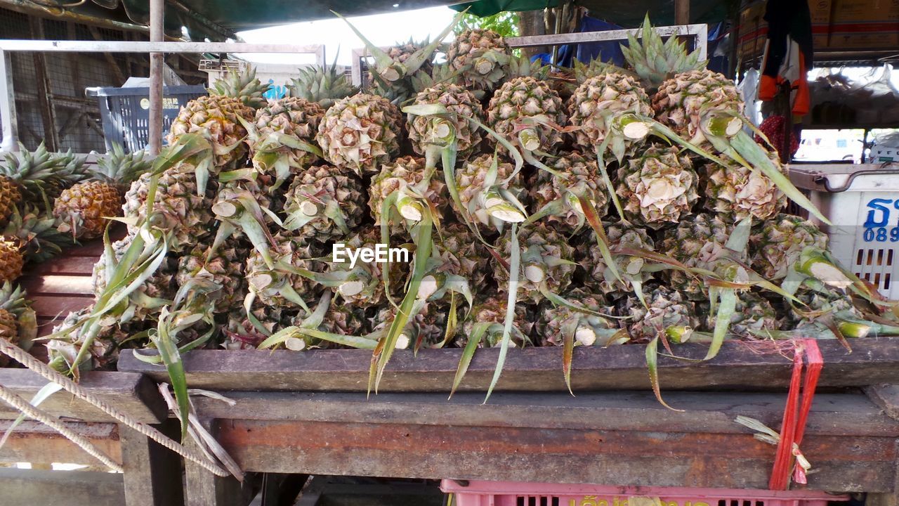 Pineapples for sale at market stall