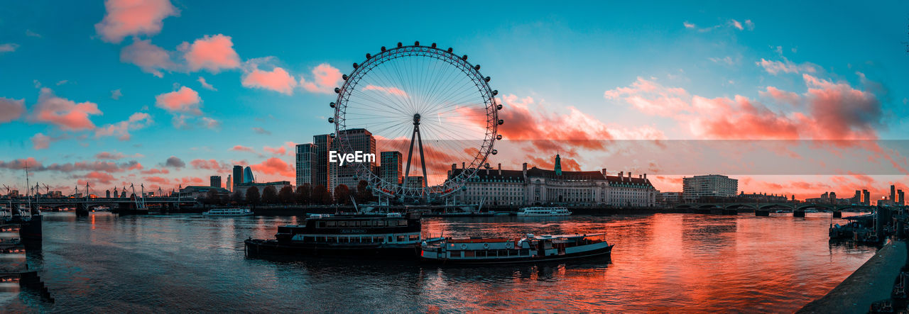 London ferris wheel in city at sunrise