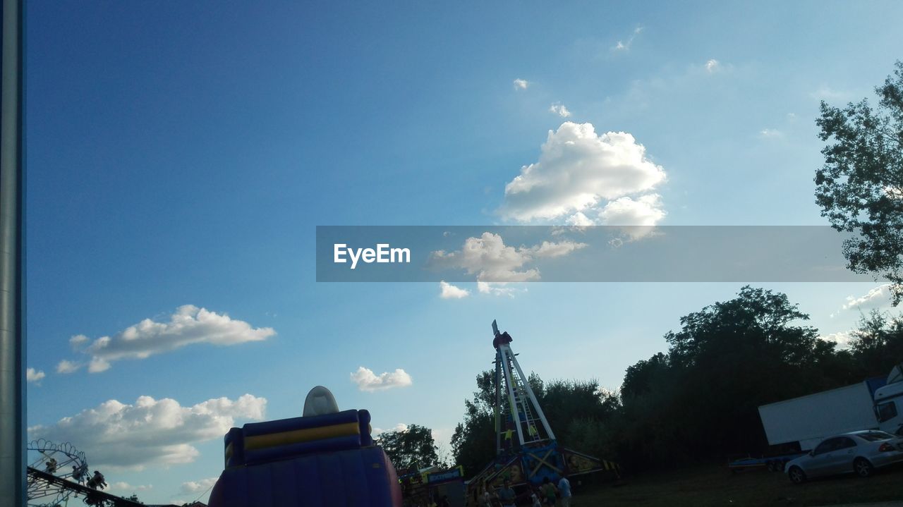 LOW ANGLE VIEW OF TREES AGAINST BLUE SKY